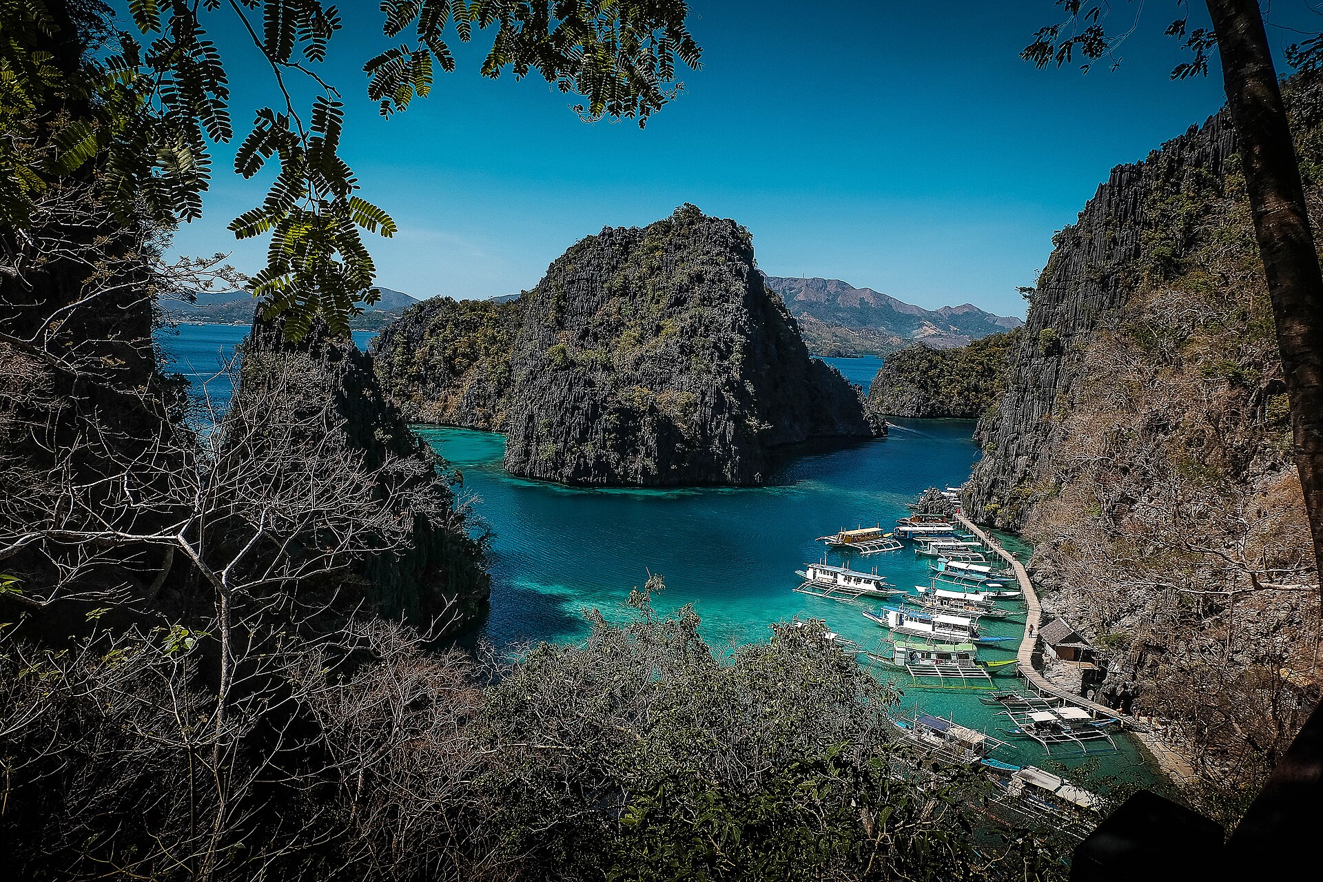 Limestone slopes and coastal water seen from the Kayangan viewpoint on Coron Island.